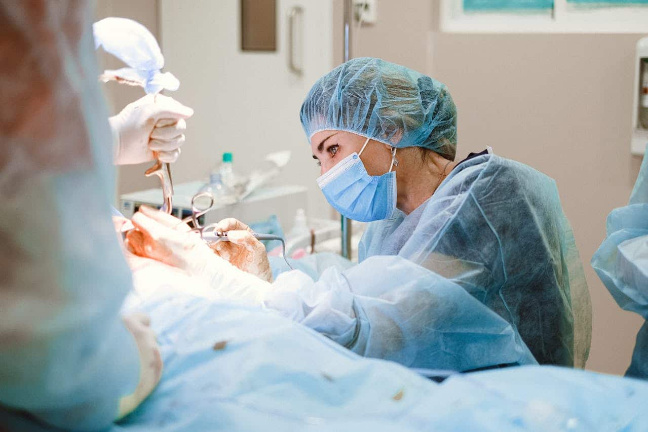 Close-up of a surgeon using surgical instruments in an operating room.